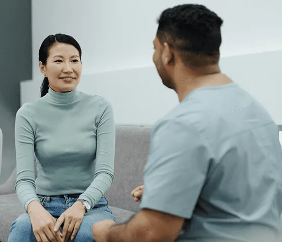 Clinician speaking with a patient